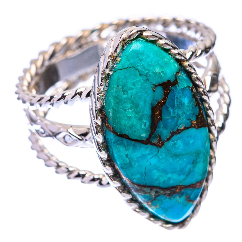 Oval turquoise cabochon ring in sterling silver with ornate side bands and blue-green stone