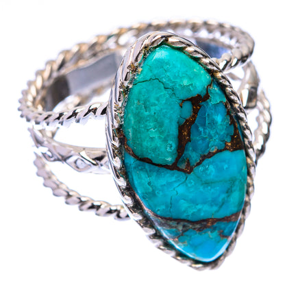 Oval turquoise cabochon ring in sterling silver with ornate side bands and blue-green stone