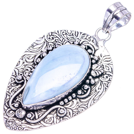 German silver opal pendant featuring a light blue oval stone and round bail loop