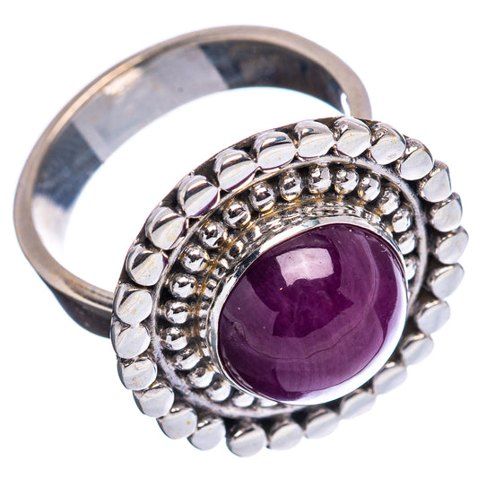 Sterling silver adjustable ring with bezel-set purple star ruby and round bead halo
