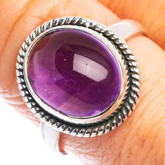 Sterling silver amethyst oval ring with rope-style bezel and dark-purple gemstone