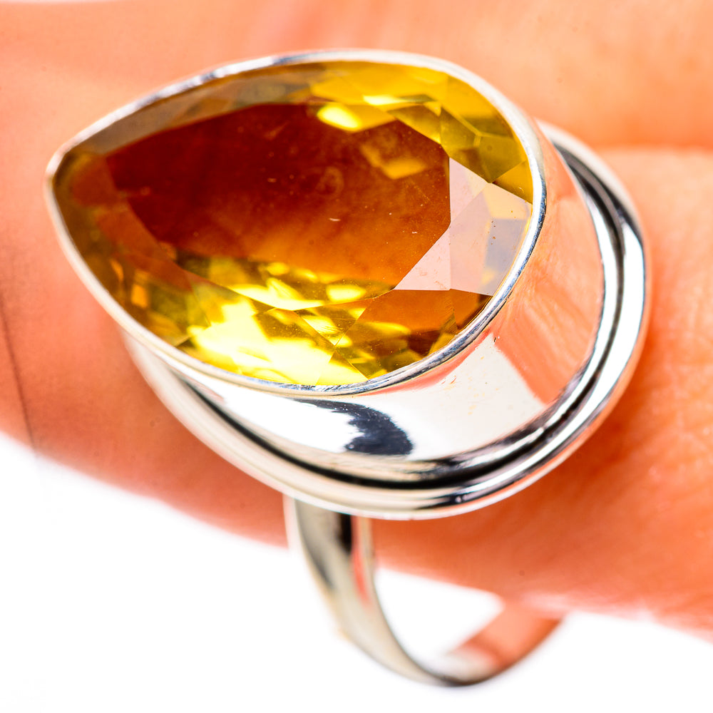 Sterling silver ring with large faceted yellow citrine gemstone in oval setting