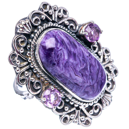 Oval purple gemstone cabochon ring with detailed sterling silver scrollwork and 3 purple stones