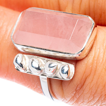 Rose quartz sterling silver ring with faceted pink stone bezel, set on silver band