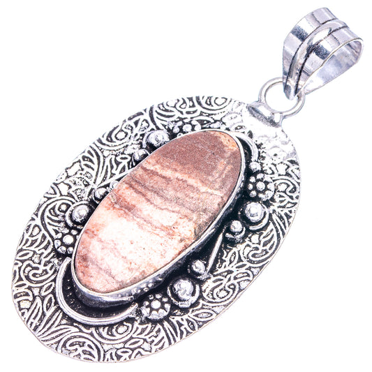 German silver filigree pendant with oval coconut jasper stone and top hanging bail
