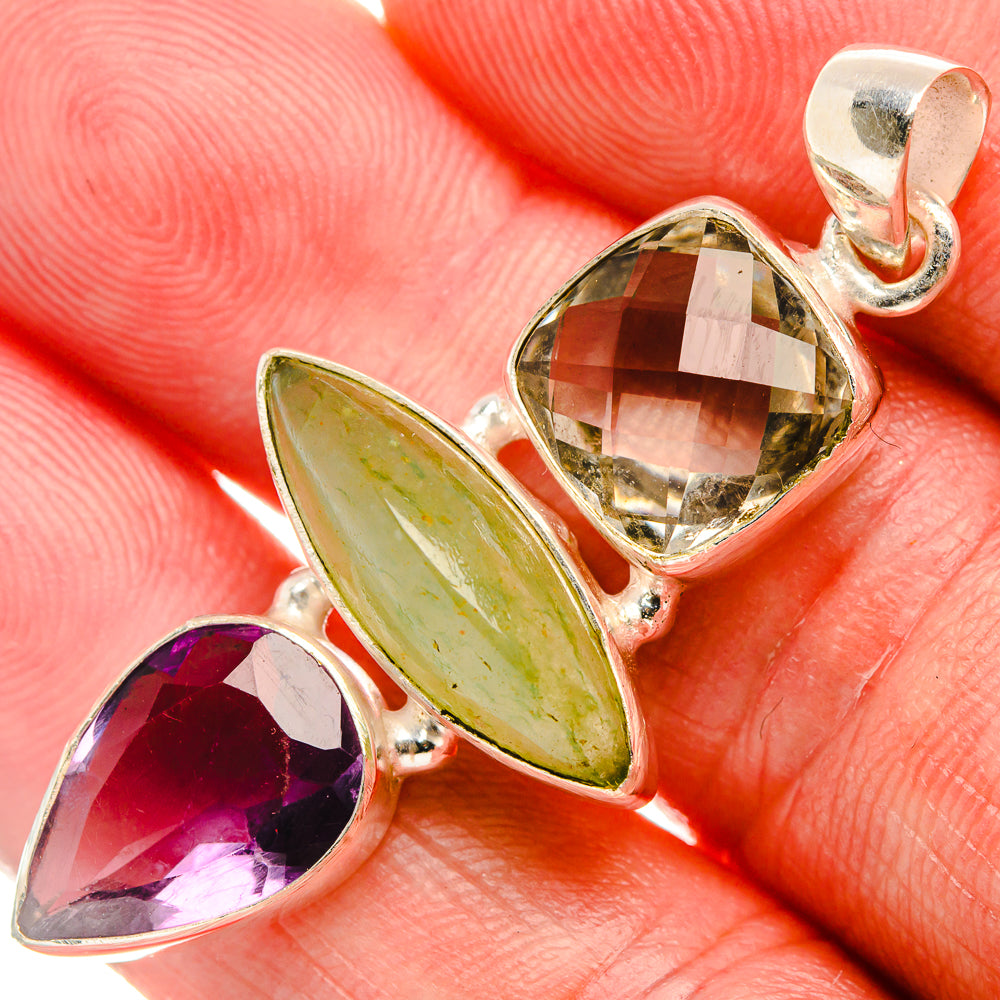 Tri-stone sterling silver pendant with green oval, purple marquise, and smoky faceted stone
