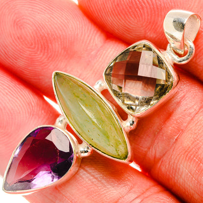 Tri-stone sterling silver pendant with green oval, purple marquise, and smoky faceted stone