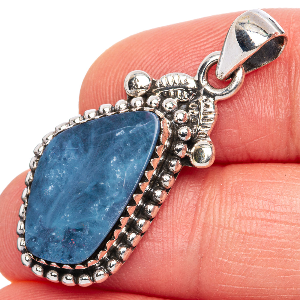 Sterling silver opal doublet pendant with teardrop blue stone in detailed bezel