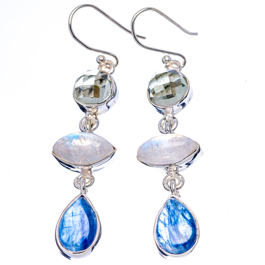 Sterling silver drop earrings with round faceted tops and blue opal-like teardrops