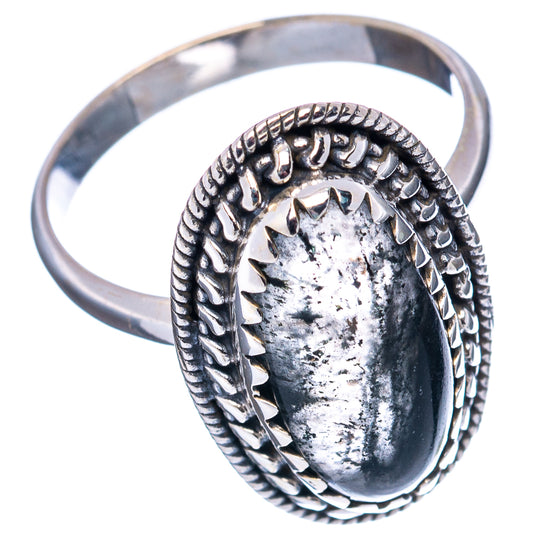 Sterling silver ring with oval quartz cabochon and engraved rope-style border