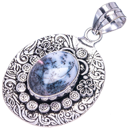 German silver dendritic opal pendant, oval blue-gray dendritic stone in carved floral frame
