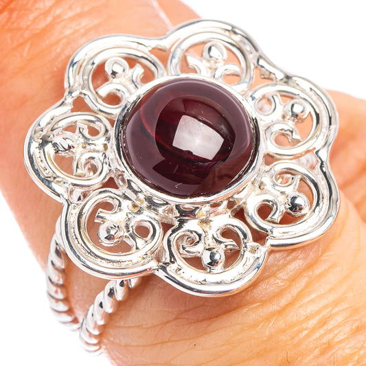 Sterling silver garnet ring with round dark red gemstone and ornate filigree setting