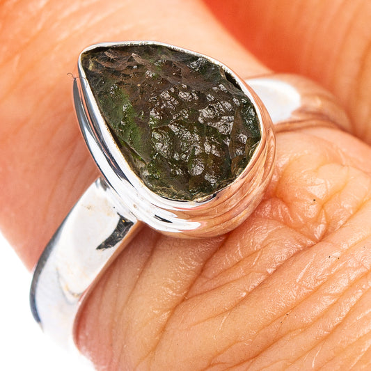 Silver ring with green moldavite teardrop stone on bezel setting