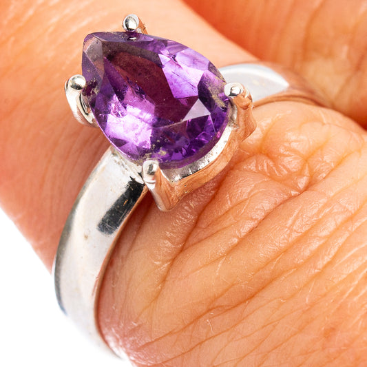 Amethyst faceted sterling silver ring with oval purple gemstone and four-prong setting