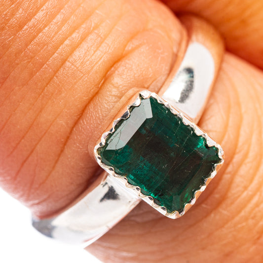 Sterling silver emerald ring close-up, square cushion deep green stone with prongs