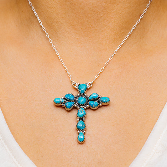 Turquoise cross pendant necklace with silver chain and oval stone accents
