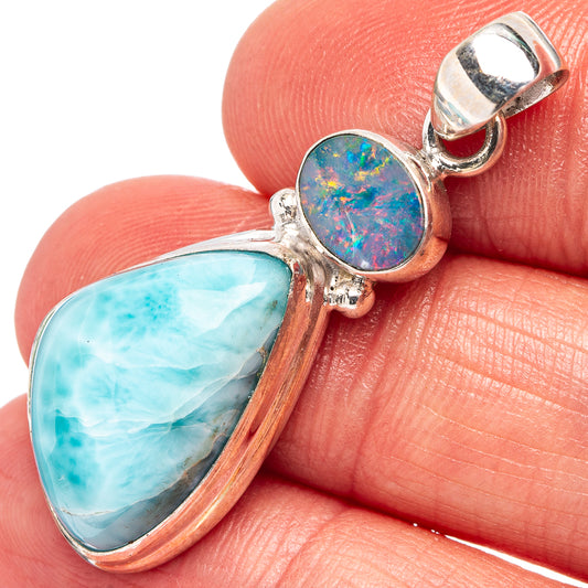 Sterling silver pendant with blue teardrop stone and round opal inlay