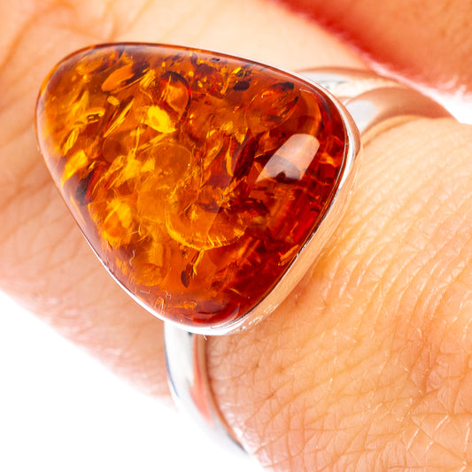 Amber heart cabochon ring in .925 sterling silver, adjustable band, size 7
