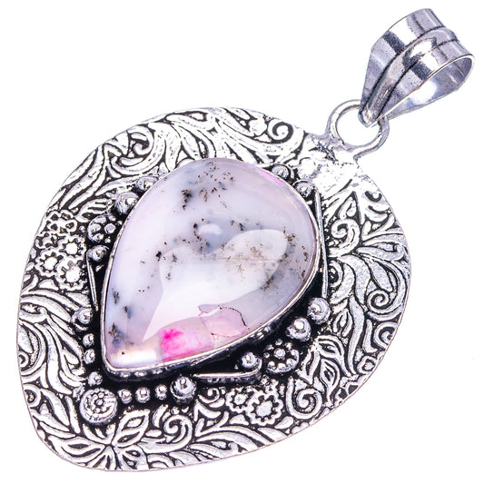German silver teardrop opal pendant with ornate filigree and pink dendritic stone