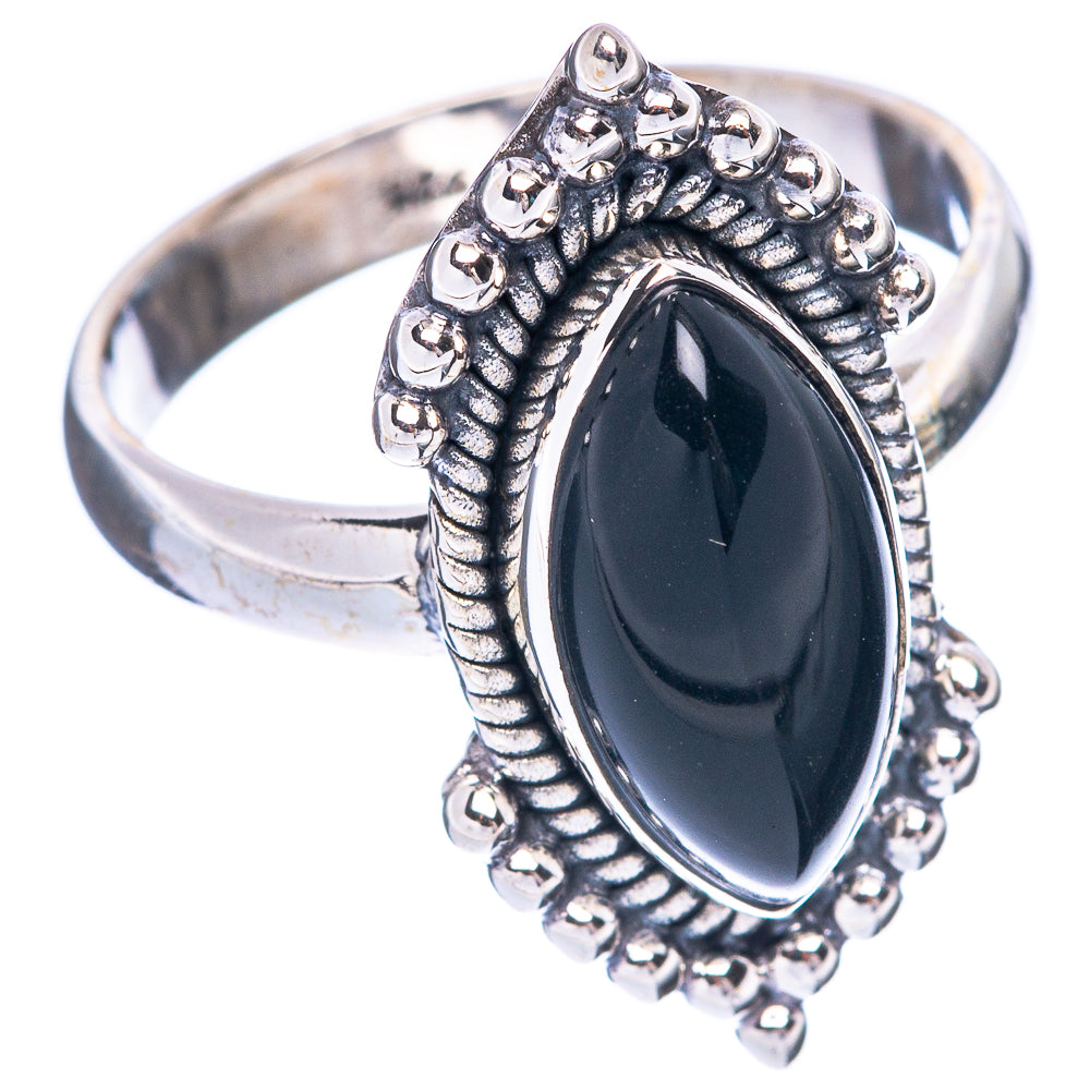 Sterling silver ring with raised oval black onyx and textured bezel detail