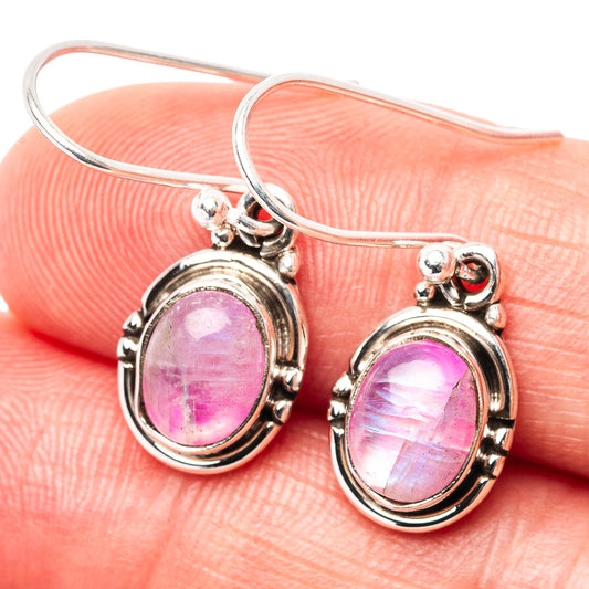 Oval pink moonstone earrings in round bezel with sterling silver hook backs