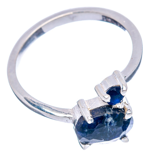 Sterling silver ring featuring a blue oval gemstone with four prongs