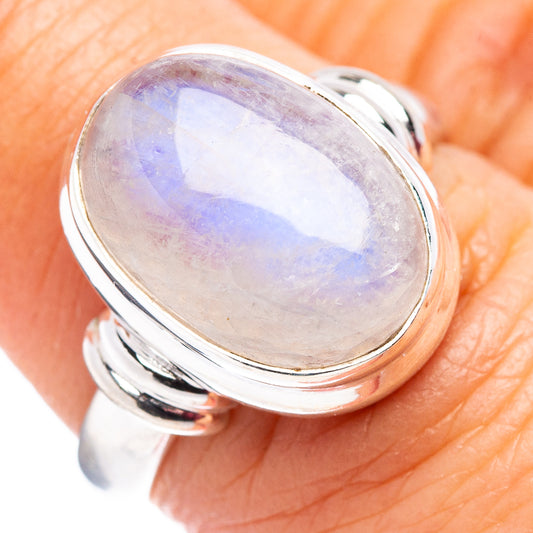Sterling silver ring with oval rainbow moonstone cabochon in high-polish bezel setting