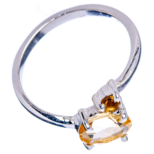 Sterling silver citrine ring with round prongs and gold-toned citrine center, side view
