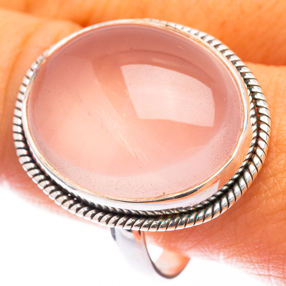 Large rose quartz cabochon ring, 925 sterling silver with rope-style bezel, close-up