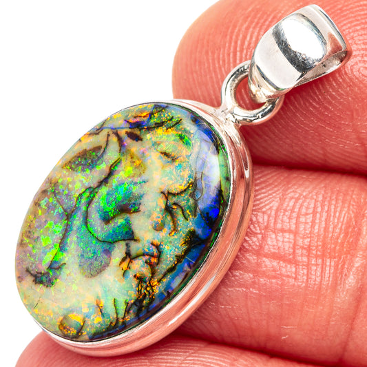 Sterling silver oval opal pendant with colorful stone and hinged bail