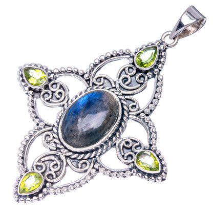 Sterling silver pendant with blue oval center stone, four green teardrops, loop bail
