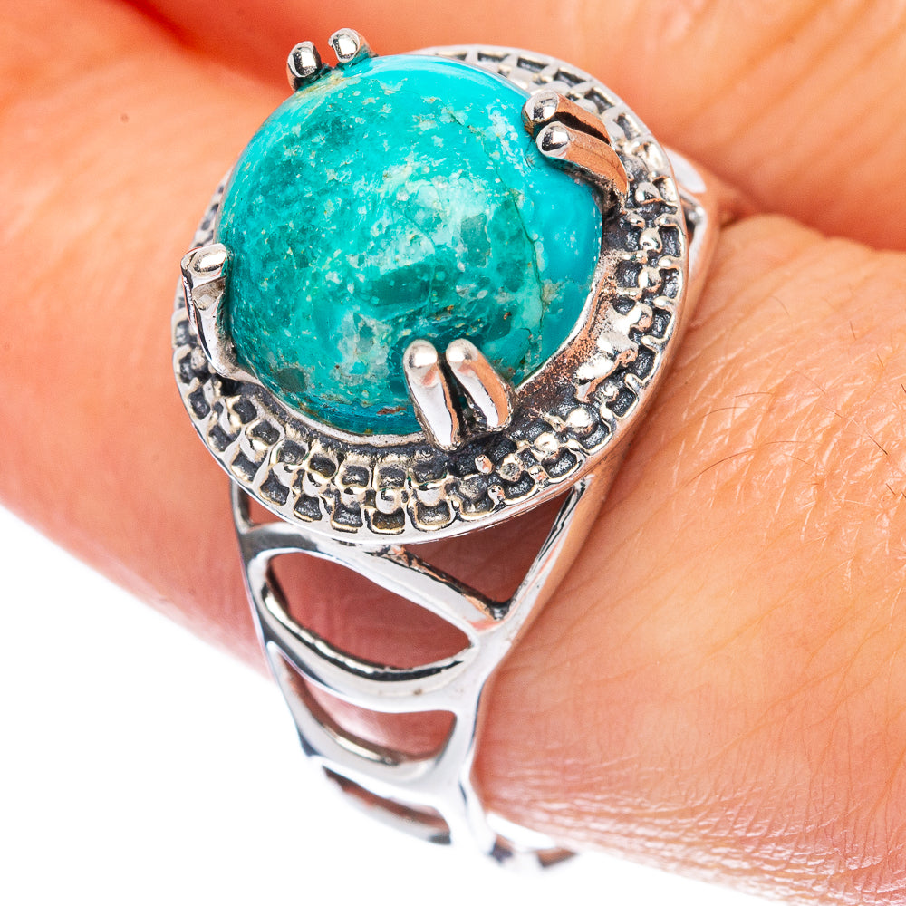 Turquoise cabochon sterling silver ring with ornate bezel and halo detailing