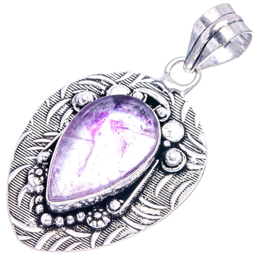 Amethyst pendant in German silver teardrop with purple cabochon stone and top loop