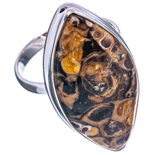 Turritella agate oval signet ring in sterling silver, angled view of amber and black stone