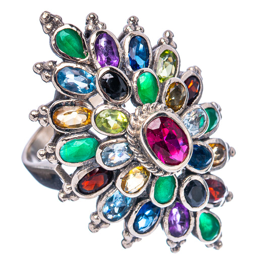 Sterling silver statement ring with large oval magenta center and surrounding blue, green gems