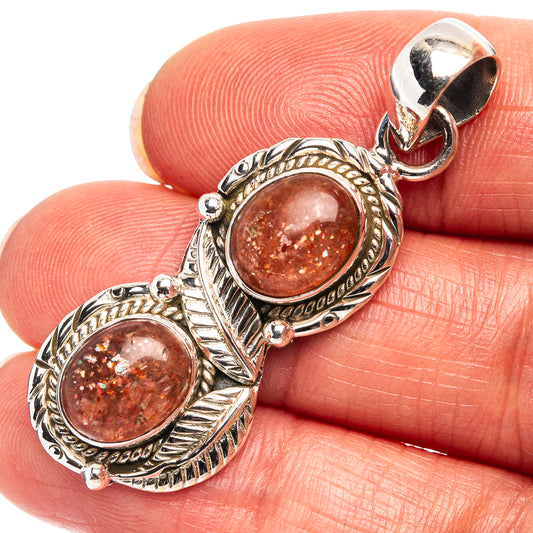 925 sterling silver sunstone pendant with two oval reddish-brown cabochons and bail