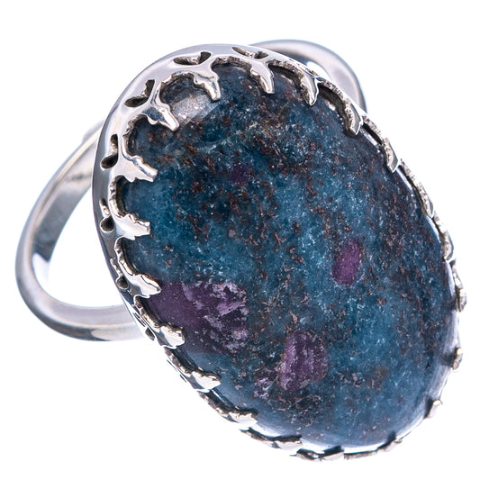 Sterling silver oval ring with prong-set blue stone and deep purple patches, side view