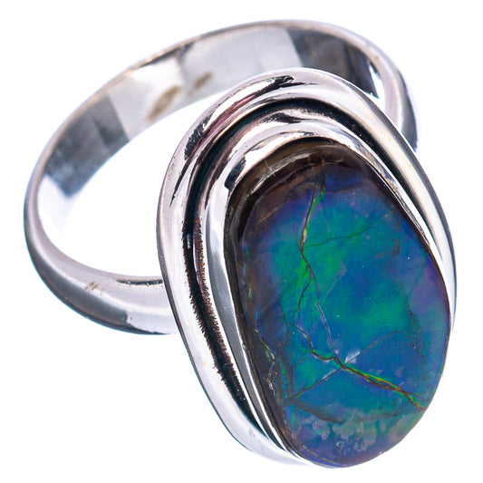 Sterling silver ammolite ring with oval blue-green stone, two-tone prong bezel