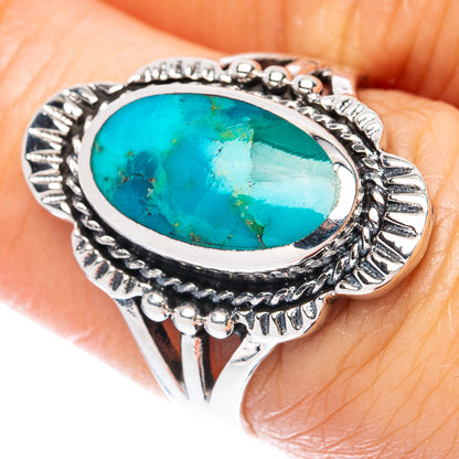 Oval turquoise cabochon sterling silver ring with ornate leaf border, size 6.75