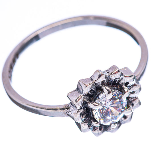 Sterling silver cubic zirconia ring, side view of faceted round center in cluster