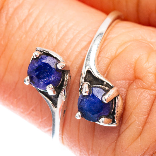 Sterling silver ring with two dark blue oval sillimanite stones on shared band