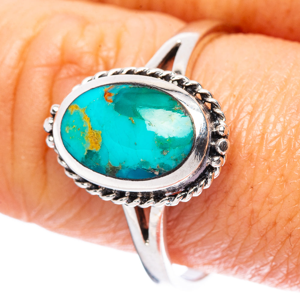 Oval turquoise cabochon sterling silver ring with ornate rope-style bezel