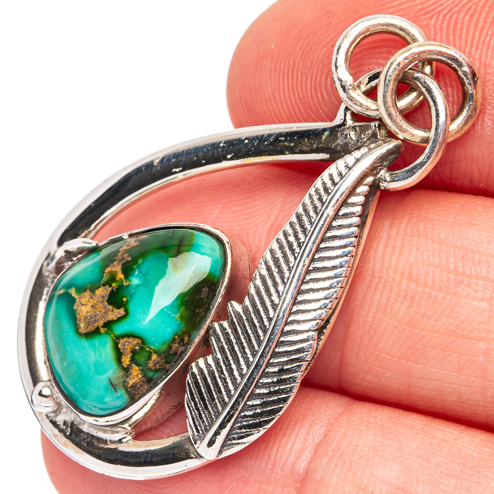 Sterling silver turquoise pendant with oval teardrop setting and linked ring bail