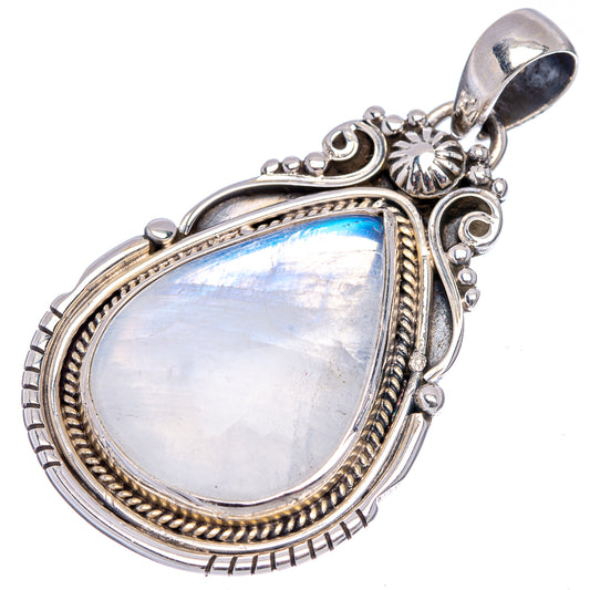 Teardrop moonstone pendant in silver with ornate filigree and bail, rainbow sheen