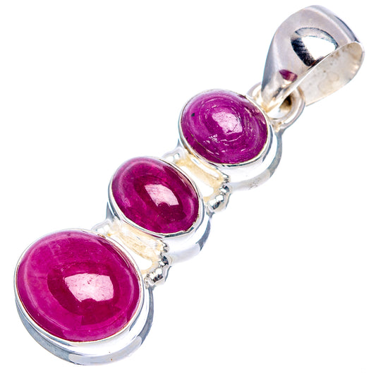 3-stone ruby pendant charm showing three oval magenta stones in silver bezel