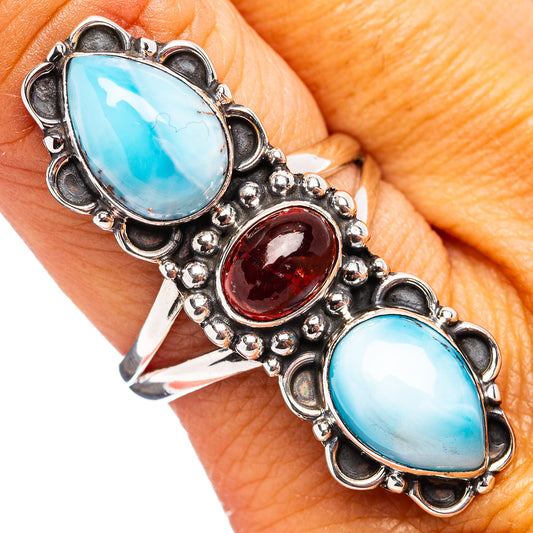 Turquoise oval gemstone ring with red center stone, ornate silver setting, size 9.