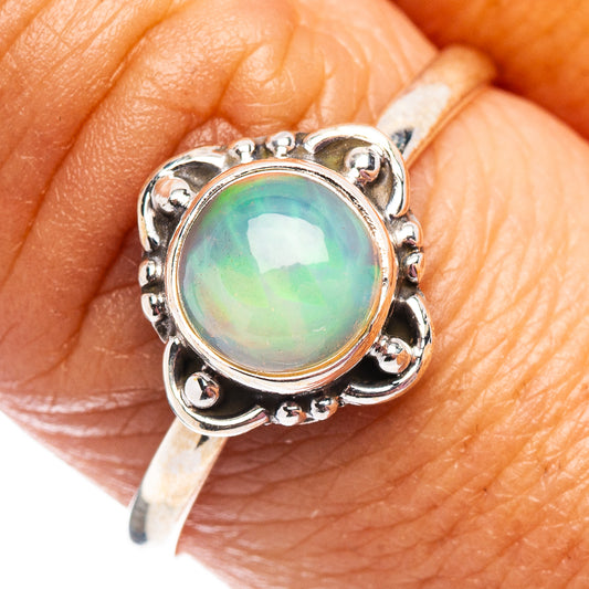 Round opal ring in .925 sterling silver, iridescent green-blue center bezel setting