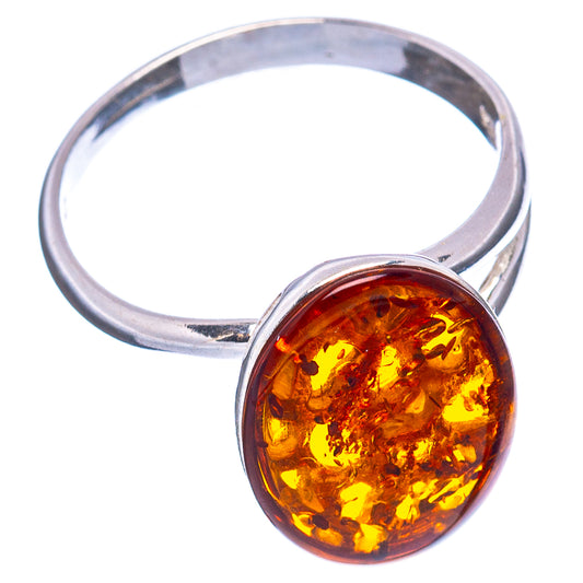 Silver adjustable ring with round amber cabochon face