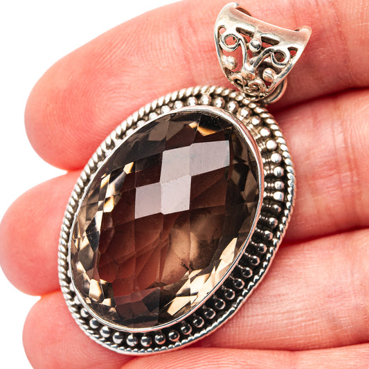 Smoky quartz oval pendant with faceted dark stone and .925 sterling silver bead border