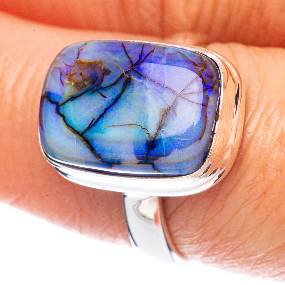 Sterling silver opal ring with oval blue-purple gemstone cabochon, high-polish band